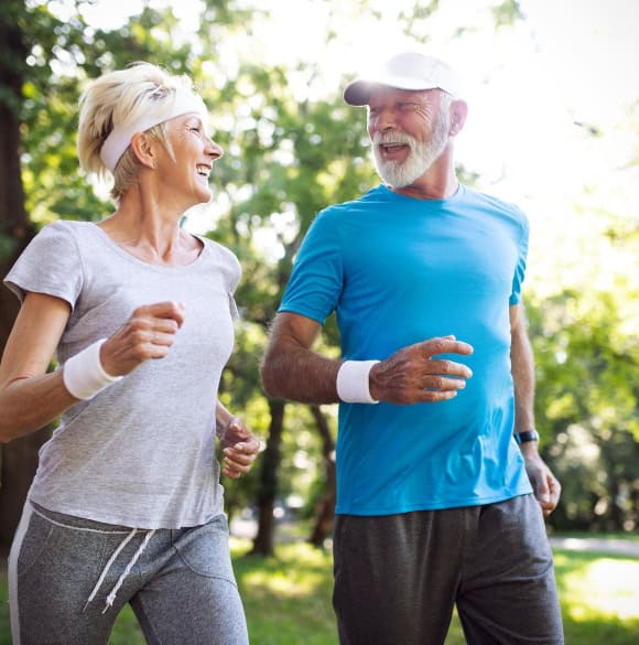 Healthy people Healthy elderly couple jogging.
